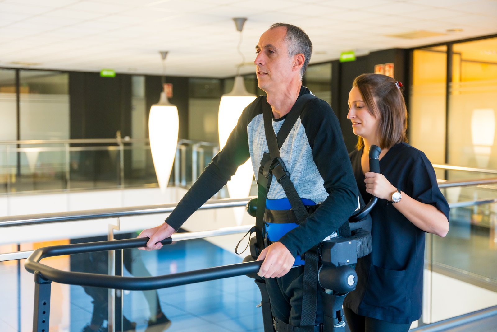 Patient using Neuro Walk Unweighting System for gait training